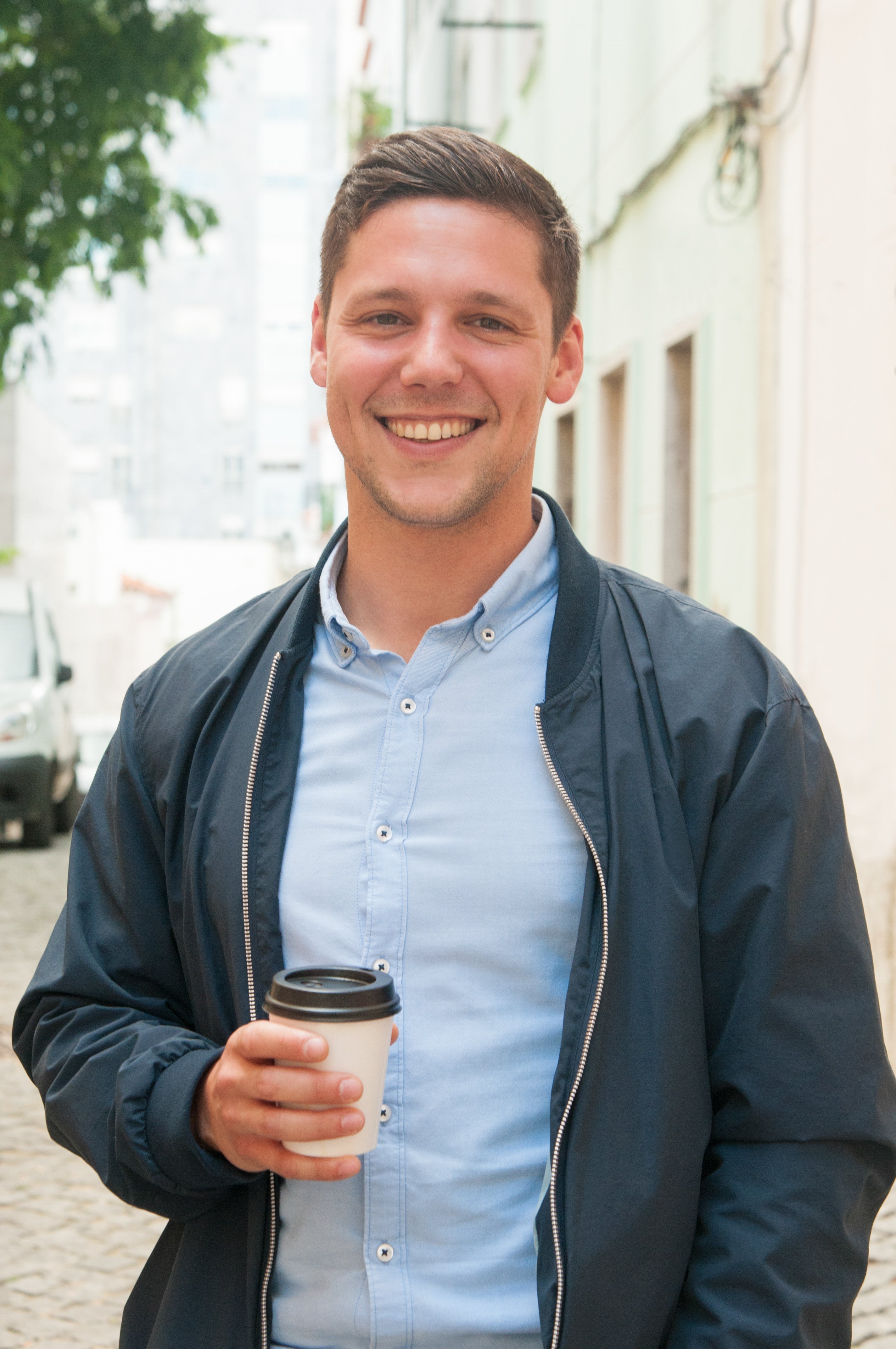 files/cheerful-guy-enjoying-outdoor-coffee-break.jpg
