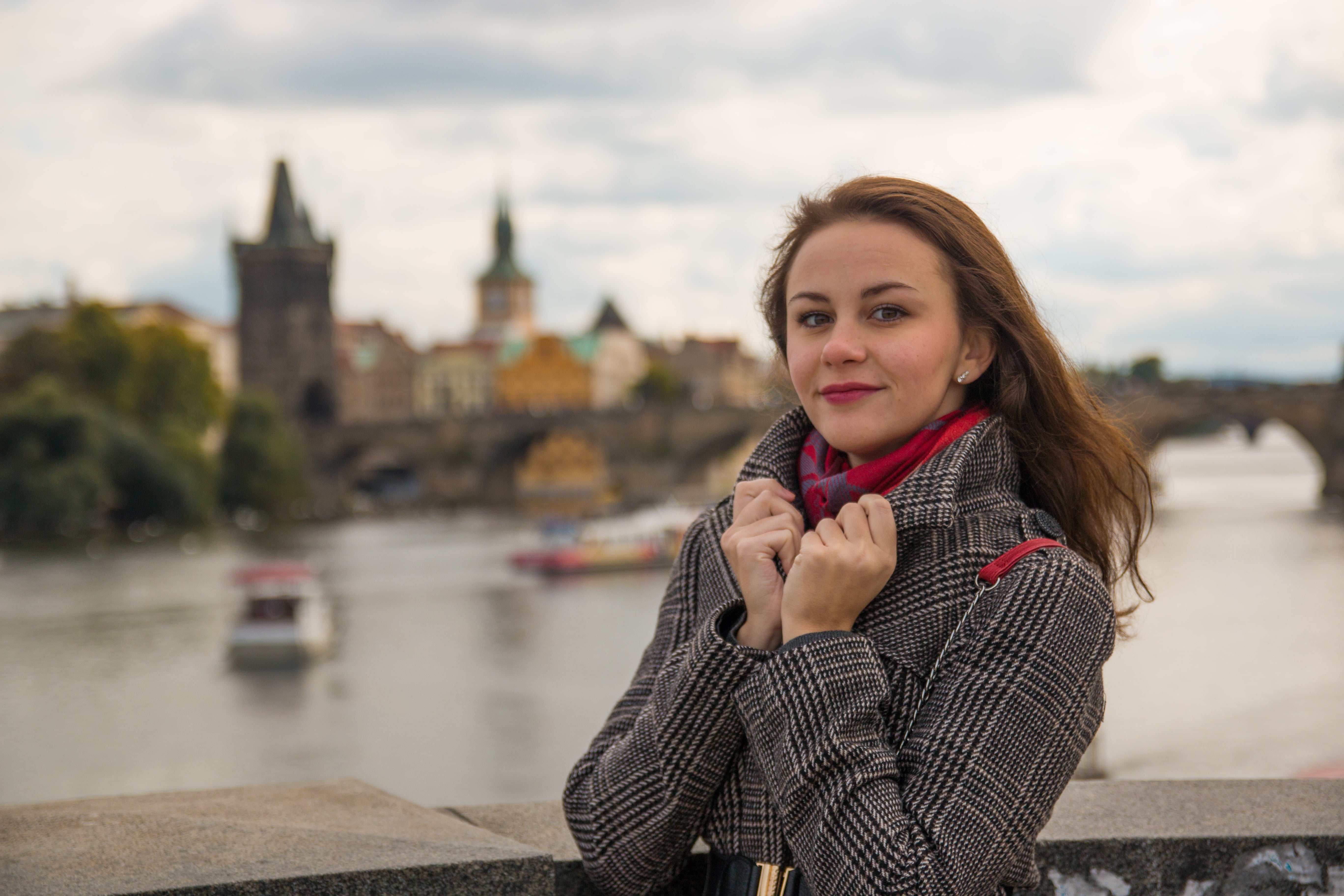 files/portrait-woman-standing-by-railing-against-charles-bridge-vltava-river.jpg